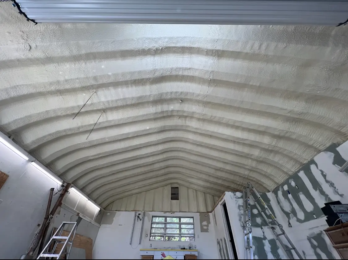 Spray polyurethane foam applied to the underside of a metal roof deck in Oregon City